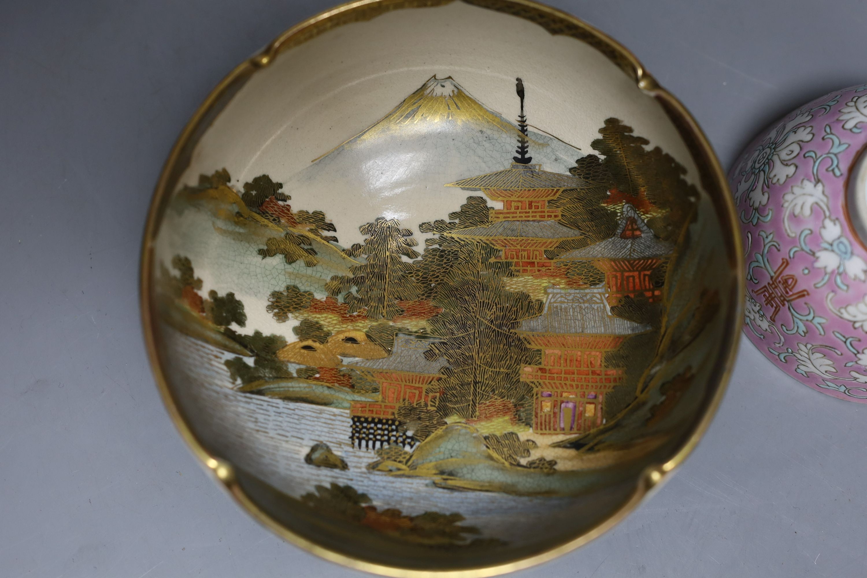 A Japanese bronze vase, an Islamic brass bottle, Chinese enamelled porcelain bowl, bronze group of man riding an ox. 29cm